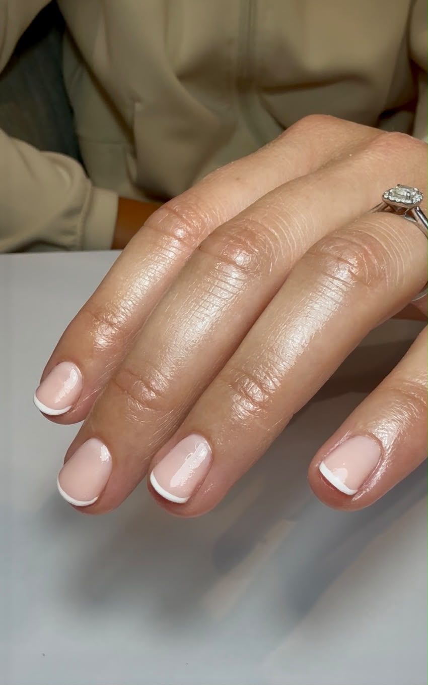Fine French manicure on natural nails